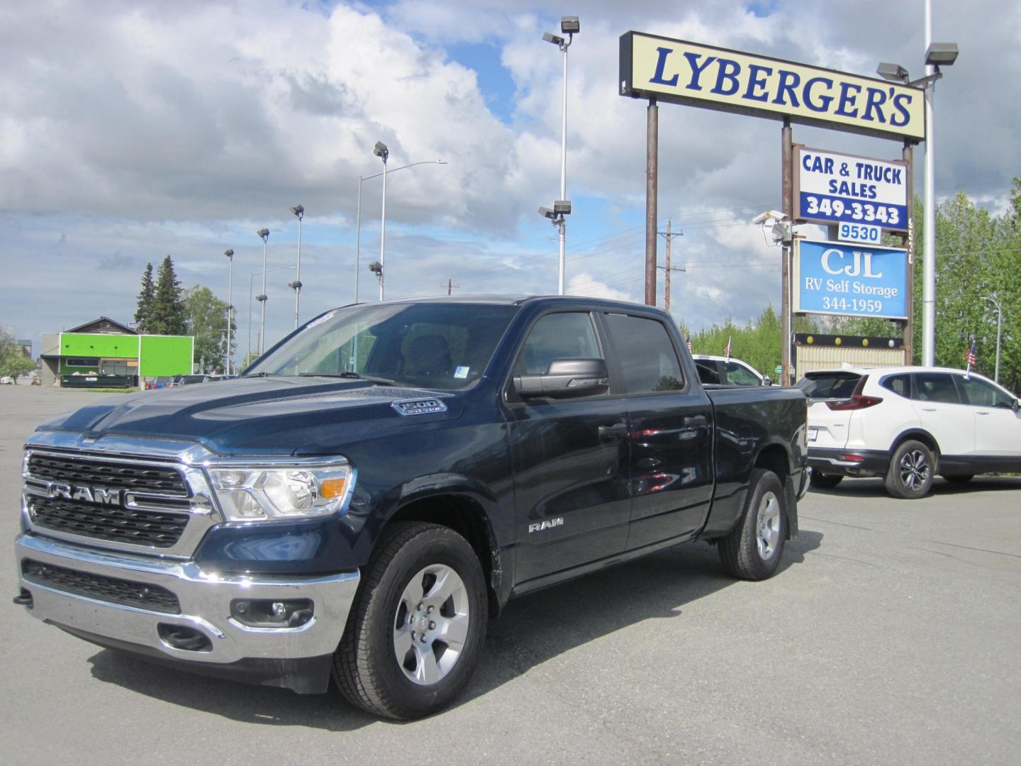 2023 blue /gray RAM 1500 Big Horn Crew Cab 4WD (1C6SRFMTXPN) with an 5.7L V8 OHV 16V engine, 8A transmission, located at 9530 Old Seward Highway, Anchorage, AK, 99515, (907) 349-3343, 61.134140, -149.865570 - Low Miles on this 2023 Ram 1500 Big Horn come take a test drive - Photo#0